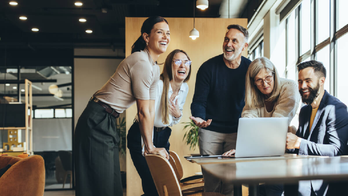 Team Talking At Desk