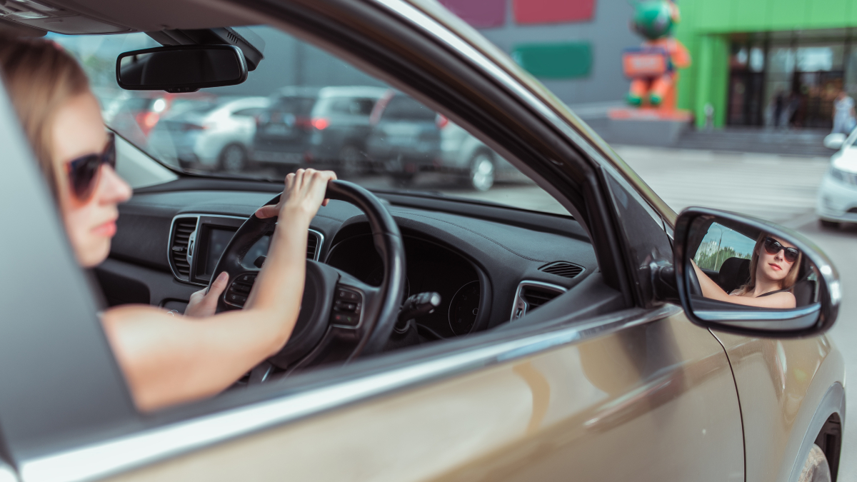 Women in rear view mirror